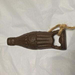 Vintage brown cast iron Ccca- Cola bottle opener Collectable
